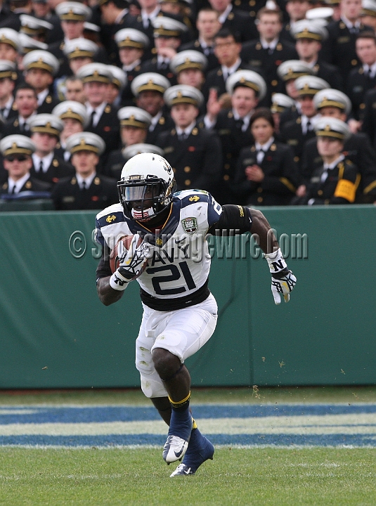 122912 Kraft SA-043.JPG - Dec 29, 2012; San Francisco, CA, USA; Navy Midshipmen Gee Gee Greene (21) returns a kickoff against the Arizona State Sun Devils in the 2012 Kraft Fighting Hunger Bowl at AT&T Park.